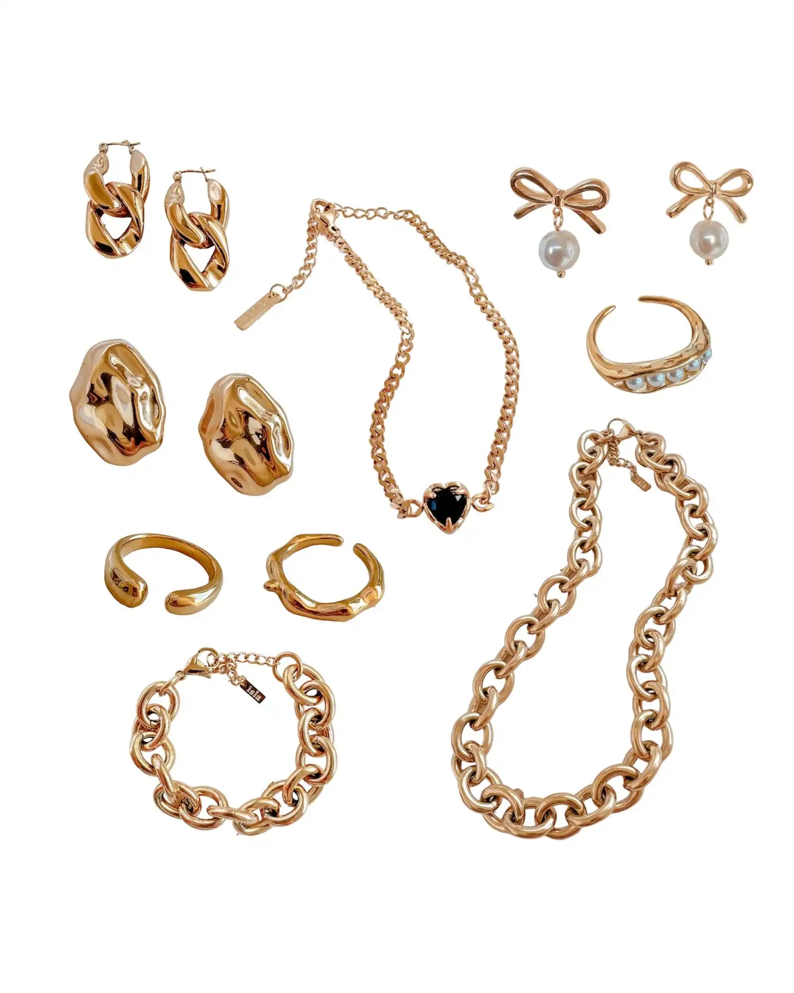 A collection of rose gold-toned jewelry including earrings, rings, necklaces, and a bracelet.